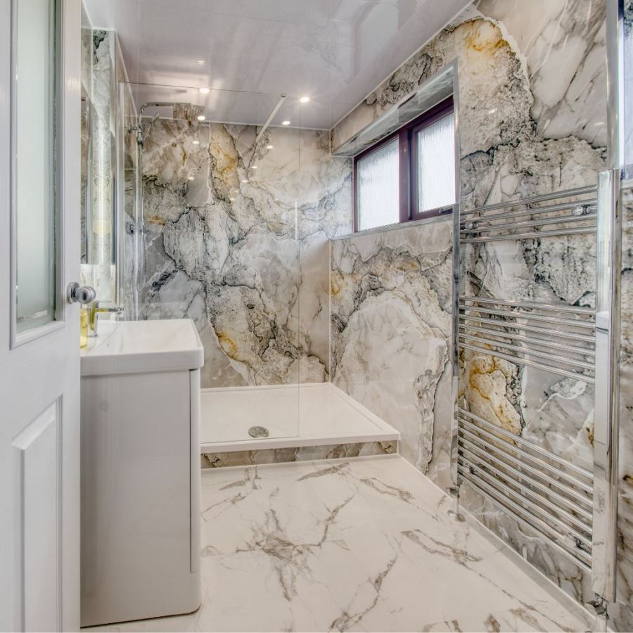 Contemporary bath with marble panels
